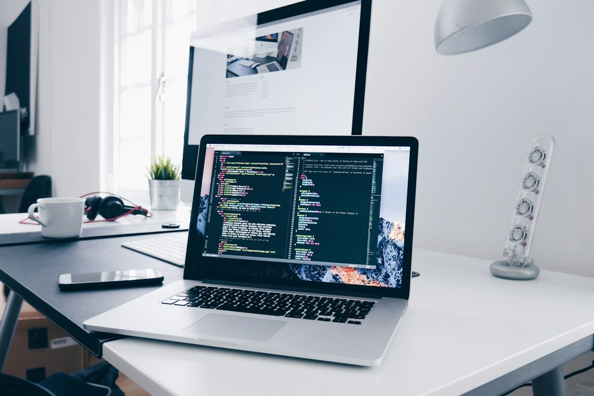 A working desk with a laptop and natural daylight