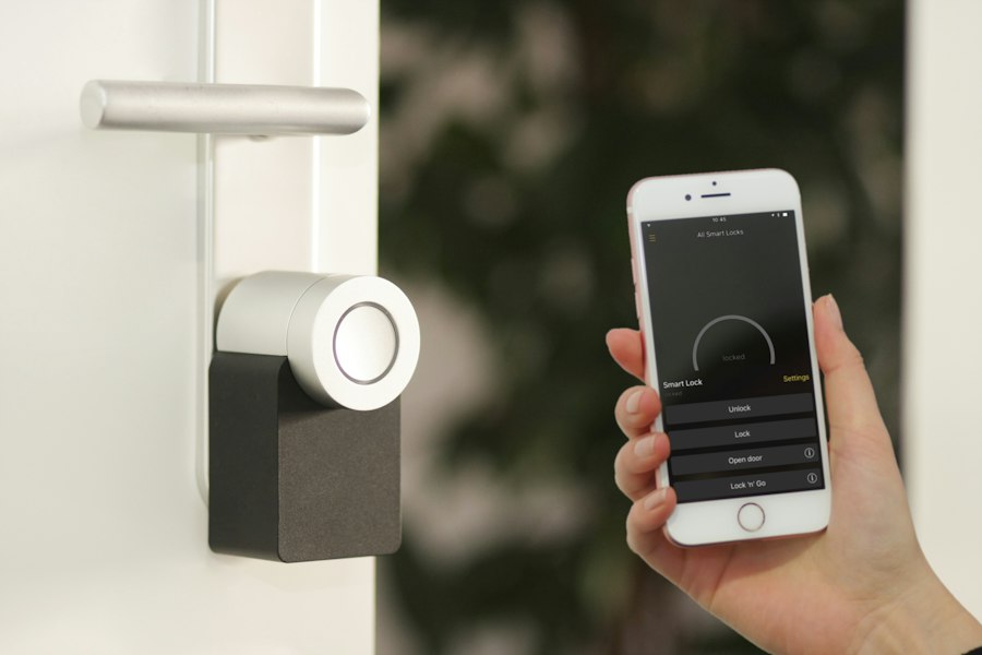 A fabric smart speaker on a living room shelf